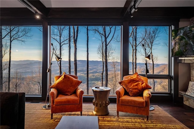 sunroom / solarium with a mountain view