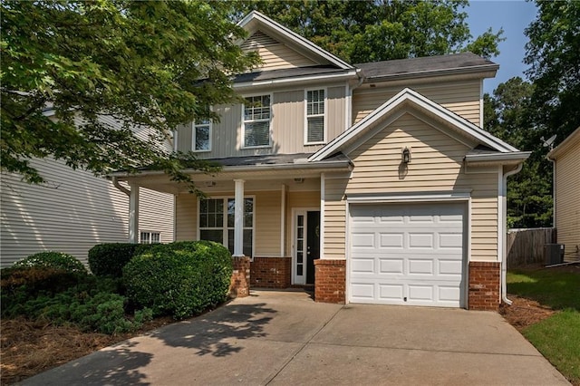 208 Oconee Way, Canton, GA 30114 - view of front of property with driveway, covered porch, brick siding, a garage, and cooling unit