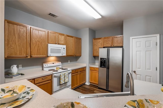 208 Oconee Way, Canton, GA 30114 - kitchen featuring white appliances, dark wood finished floors, light countertops, and a sink