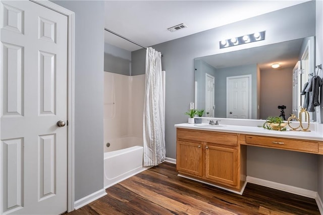 208 Oconee Way, Canton, GA 30114 - bathroom with vanity, wood finished floors, shower / bathtub combination with curtain, and baseboards