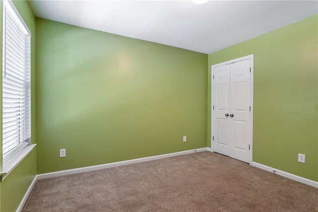 208 Oconee Way, Canton, GA 30114 - carpeted empty room with baseboards