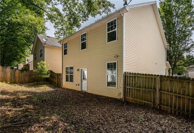 208 Oconee Way, Canton, GA 30114 - rear view of property featuring a fenced backyard
