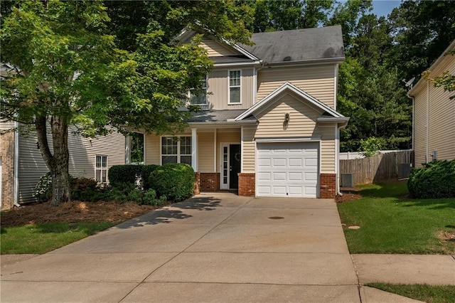 208 Oconee Way, Canton, GA 30114 - view of front of home featuring concrete driveway, brick siding, and central AC unit