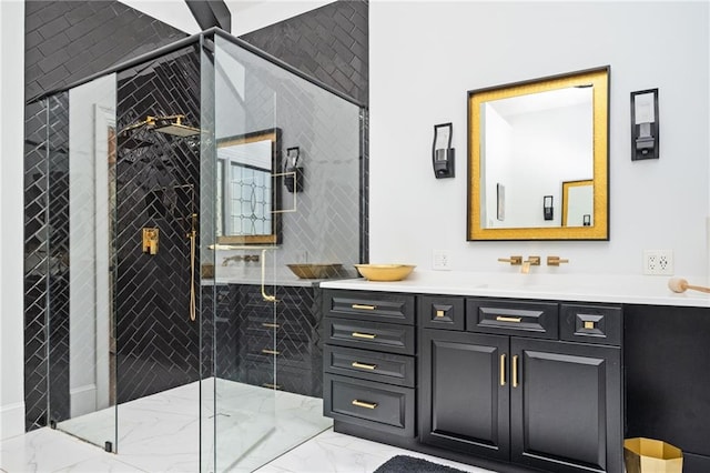 bathroom featuring vanity and a shower with shower door