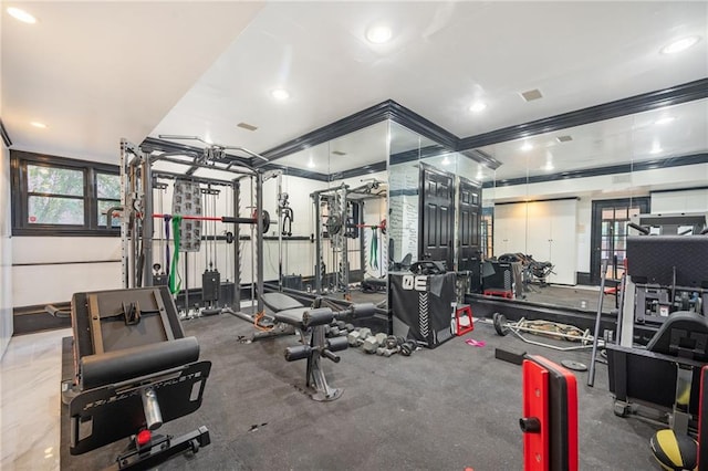 exercise room featuring ornamental molding