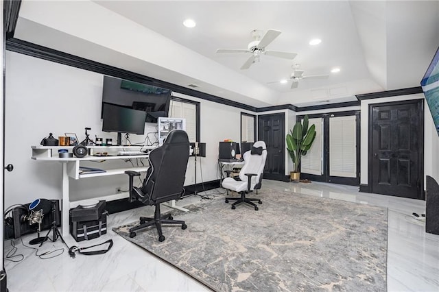 home office with a tray ceiling and ceiling fan