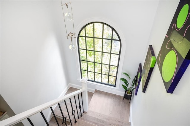 stairway featuring hardwood / wood-style flooring