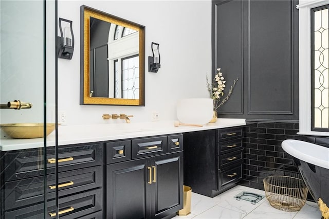 bathroom featuring vanity and tile walls