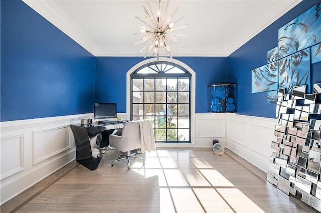 office space with crown molding, a notable chandelier, and light wood-type flooring