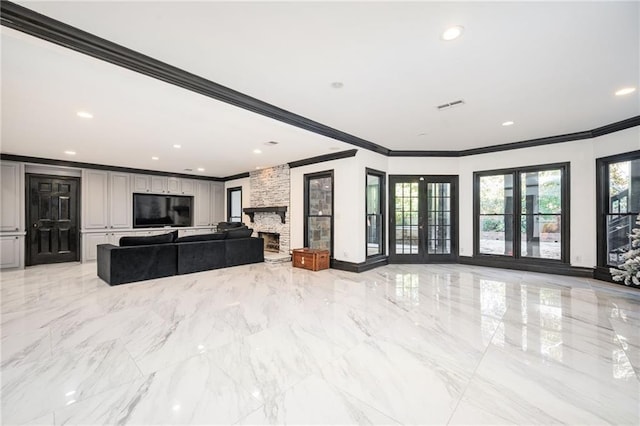 living room with a fireplace, french doors, and crown molding