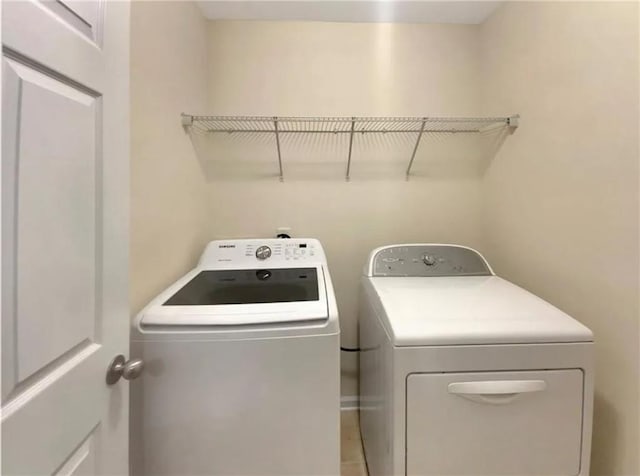 laundry area with independent washer and dryer