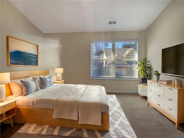 bedroom with carpet and lofted ceiling