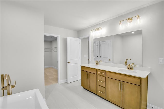 bathroom with vanity and a washtub