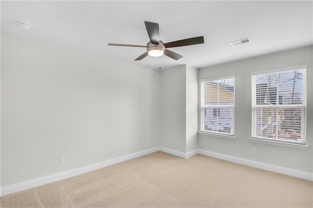 carpeted empty room with ceiling fan