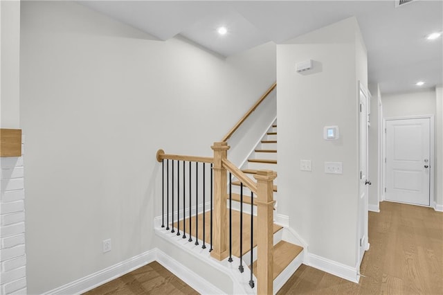 stairway with wood-type flooring