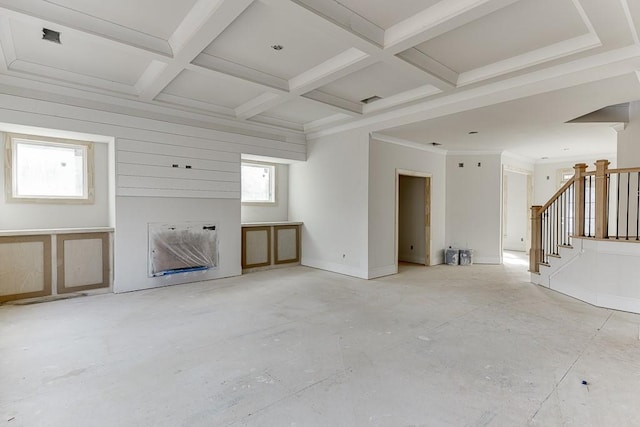 unfurnished living room featuring beam ceiling and coffered ceiling