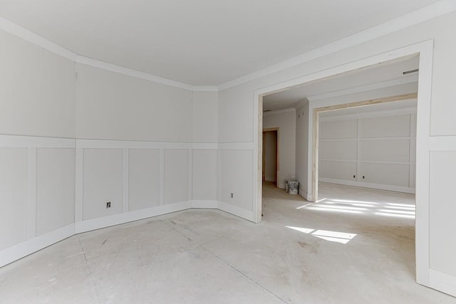 unfurnished room featuring crown molding