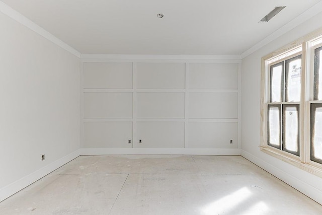 unfurnished room with crown molding