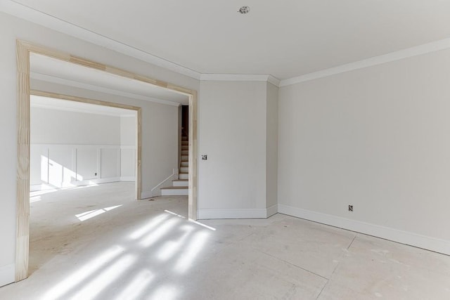 empty room featuring ornamental molding