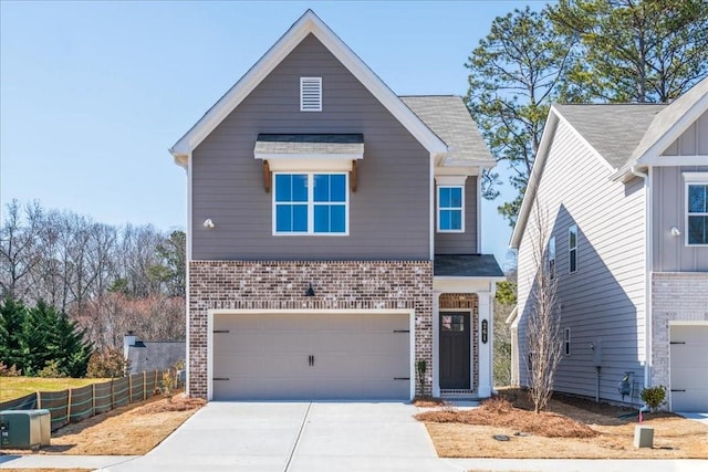 view of front facade featuring a garage, brick siding, driveway, and fence