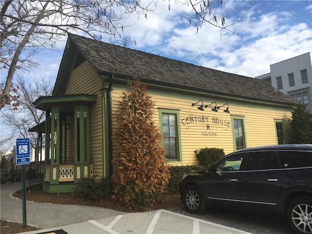 view of side of home featuring uncovered parking