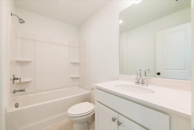 bathroom featuring toilet, tub / shower combination, and vanity