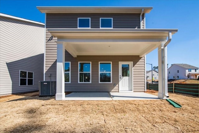 back of house with a patio, fence, and central air condition unit