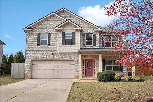 view of front of property with a garage, a front yard, and central AC