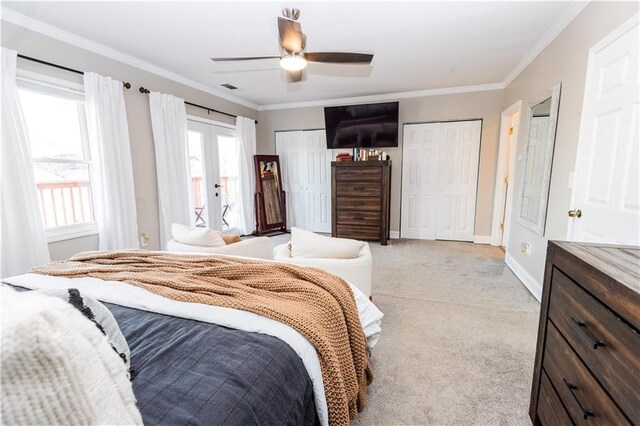 bedroom with french doors, light colored carpet, crown molding, and baseboards