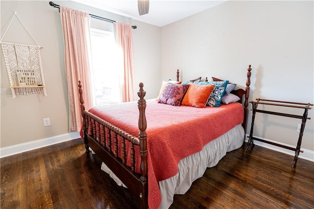 bedroom with a ceiling fan, baseboards, and wood finished floors