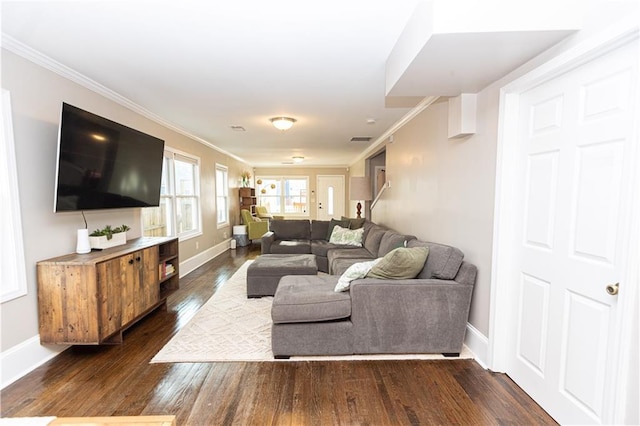 living area featuring visible vents, baseboards, dark wood-type flooring, and crown molding