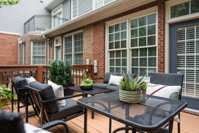 wooden terrace featuring outdoor lounge area