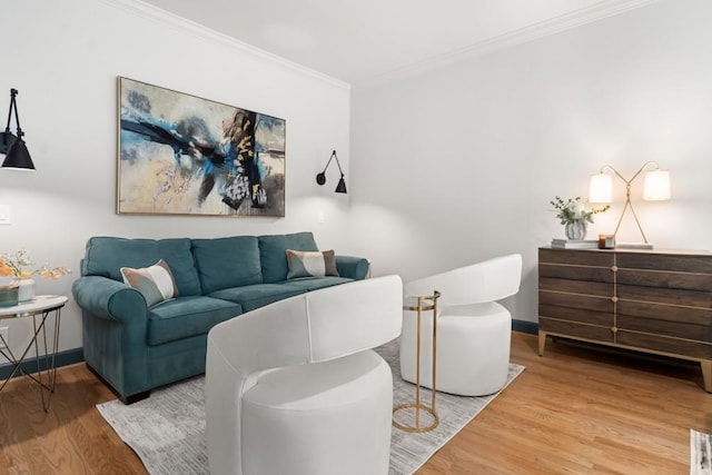 bedroom featuring crown molding, light wood finished floors, access to outside, and multiple windows