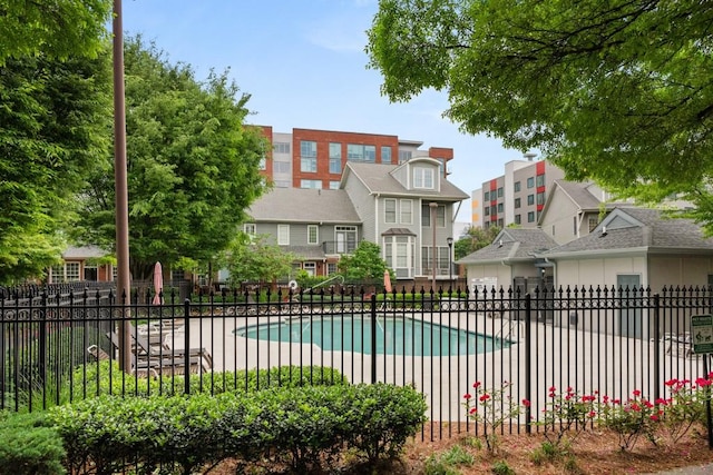 community pool featuring fence