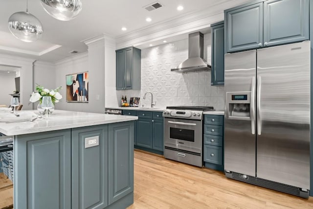 kitchen with light countertops, a kitchen bar, wall chimney range hood, and stainless steel fridge with ice dispenser