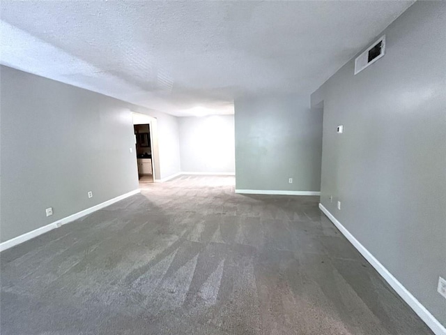 3020 Wingate Way, Sandy Springs, GA 30350 - empty room with a textured ceiling, carpet floors, visible vents, and baseboards