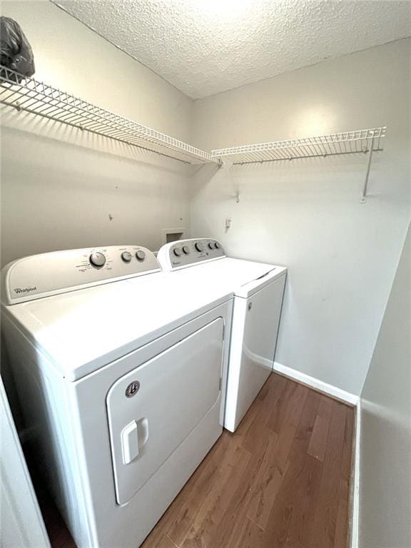 3020 Wingate Way, Sandy Springs, GA 30350 - washroom featuring a textured ceiling, separate washer and dryer, wood finished floors, laundry area, and baseboards