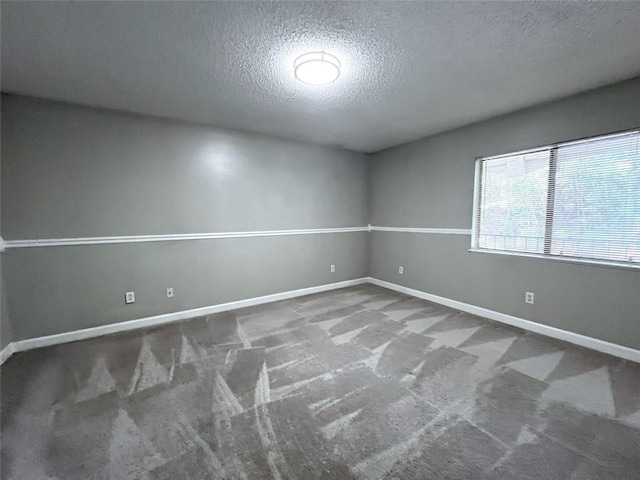 3020 Wingate Way, Sandy Springs, GA 30350 - empty room featuring a textured ceiling, carpet floors, and baseboards