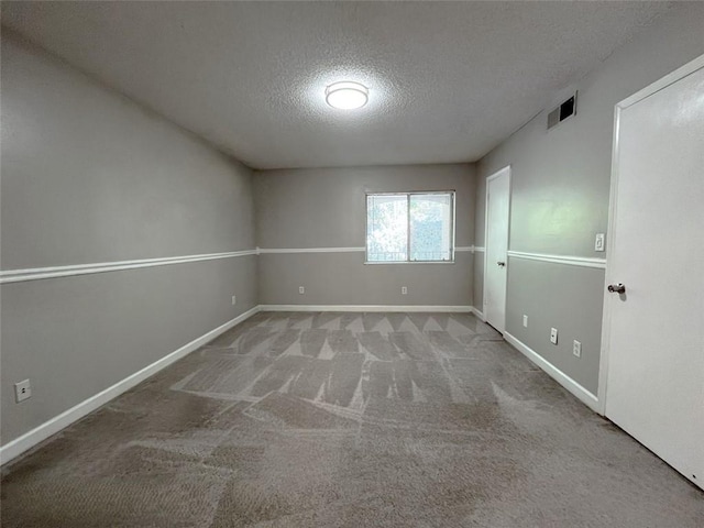 3020 Wingate Way, Sandy Springs, GA 30350 - carpeted spare room featuring baseboards, visible vents, and a textured ceiling
