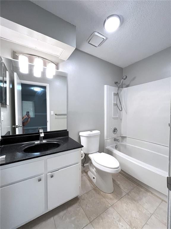 3020 Wingate Way, Sandy Springs, GA 30350 - full bathroom with a textured ceiling, toilet, vanity, tile patterned floors, and washtub / shower combination