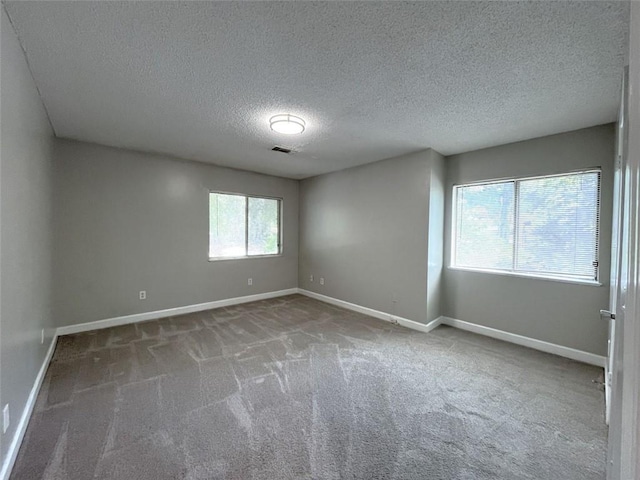 3020 Wingate Way, Sandy Springs, GA 30350 - carpeted empty room featuring visible vents, baseboards, and a textured ceiling