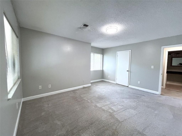 3020 Wingate Way, Sandy Springs, GA 30350 - carpeted spare room featuring visible vents, a textured ceiling, and baseboards