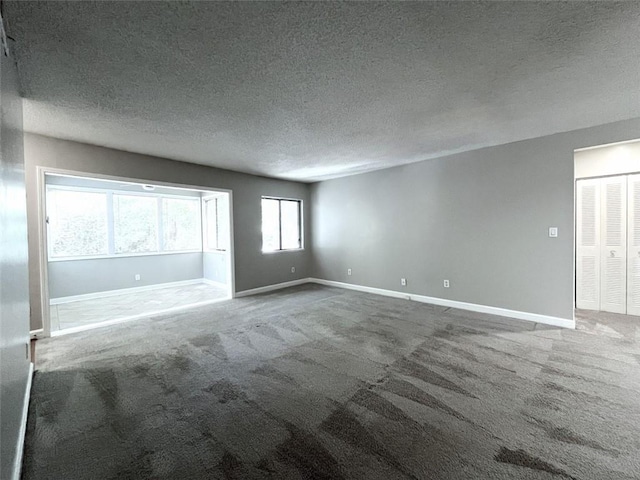 3020 Wingate Way, Sandy Springs, GA 30350 - carpeted empty room with a textured ceiling and baseboards