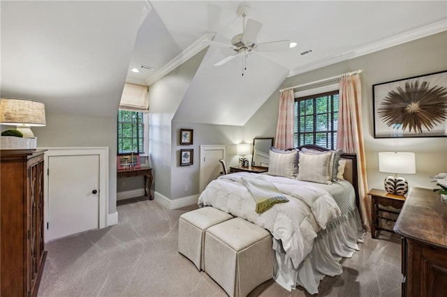 carpeted bedroom with crown molding, vaulted ceiling, and ceiling fan