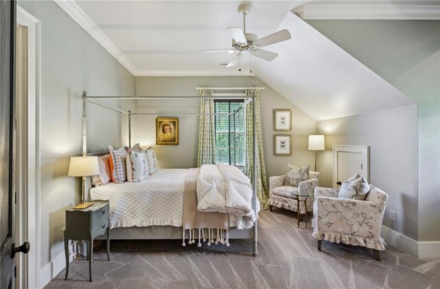 carpeted bedroom featuring lofted ceiling, ornamental molding, and ceiling fan