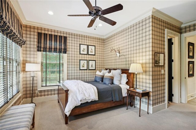 bedroom featuring light carpet, ceiling fan, and crown molding