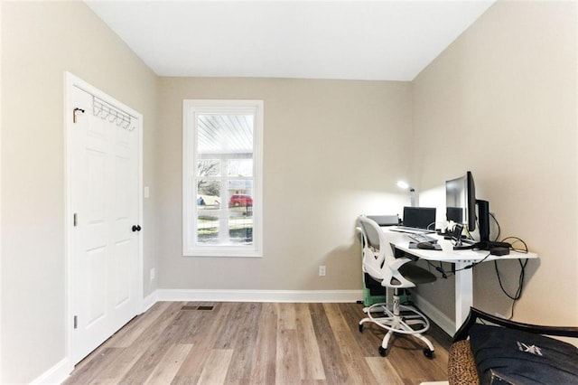 office area featuring wood finished floors and baseboards