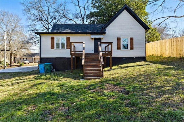 view of front facade with stairway, crawl space, fence, a front lawn, and a wooden deck