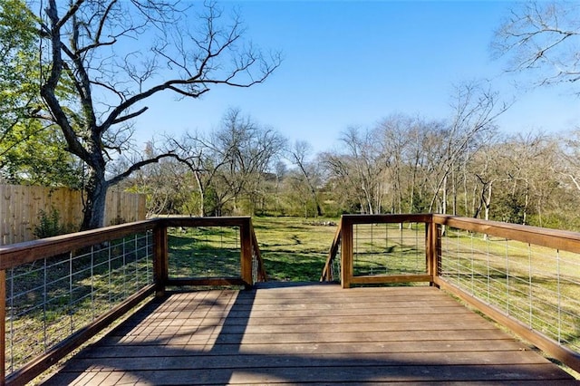 deck with fence and a lawn