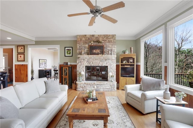 79 Strawberry Way, Jasper, GA 30143 - living room featuring ceiling fan, light wood-style floors, a stone fireplace, and crown molding